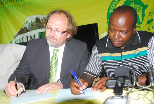 Young Africans Sports Club New Head Coach, Tom Saintfiet (left) signed a two year contract at the club house, infront of Yanga C.E.O Mwesigwa Selestine